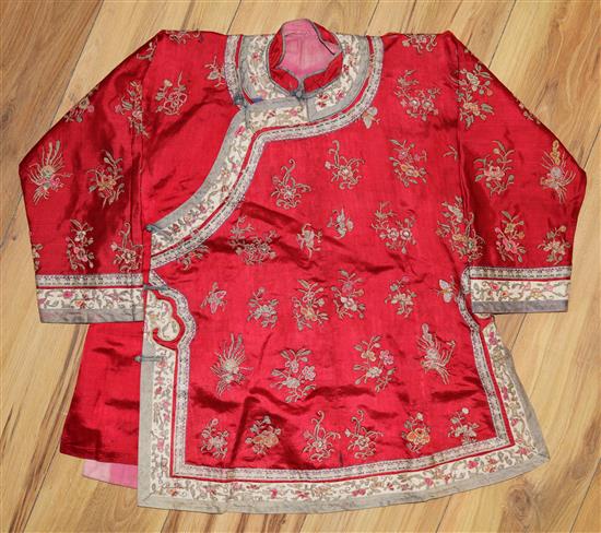 A Chinese embroidered red silk coat